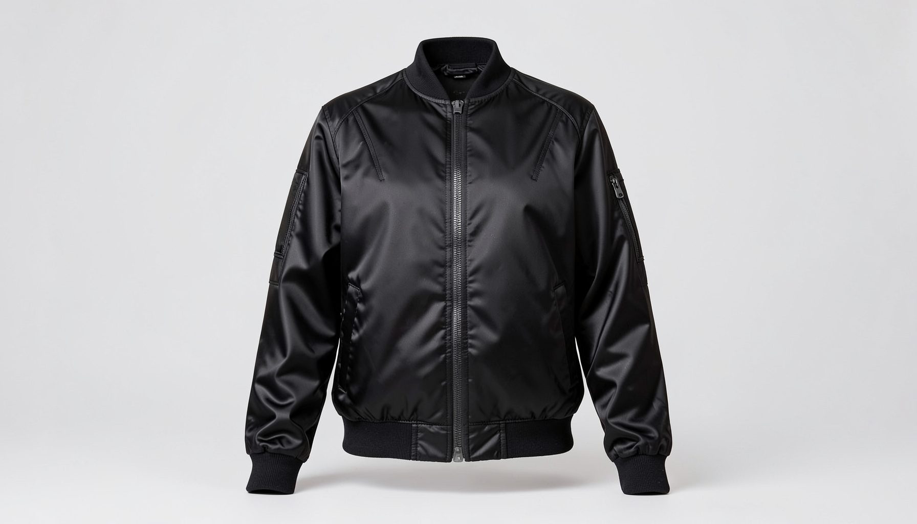 Black satin racer bomber jacket with contrast detailing under soft studio lighting